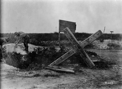 Soldiers erecting a cross remembering New Zealanders killed at the Battle of the Somme